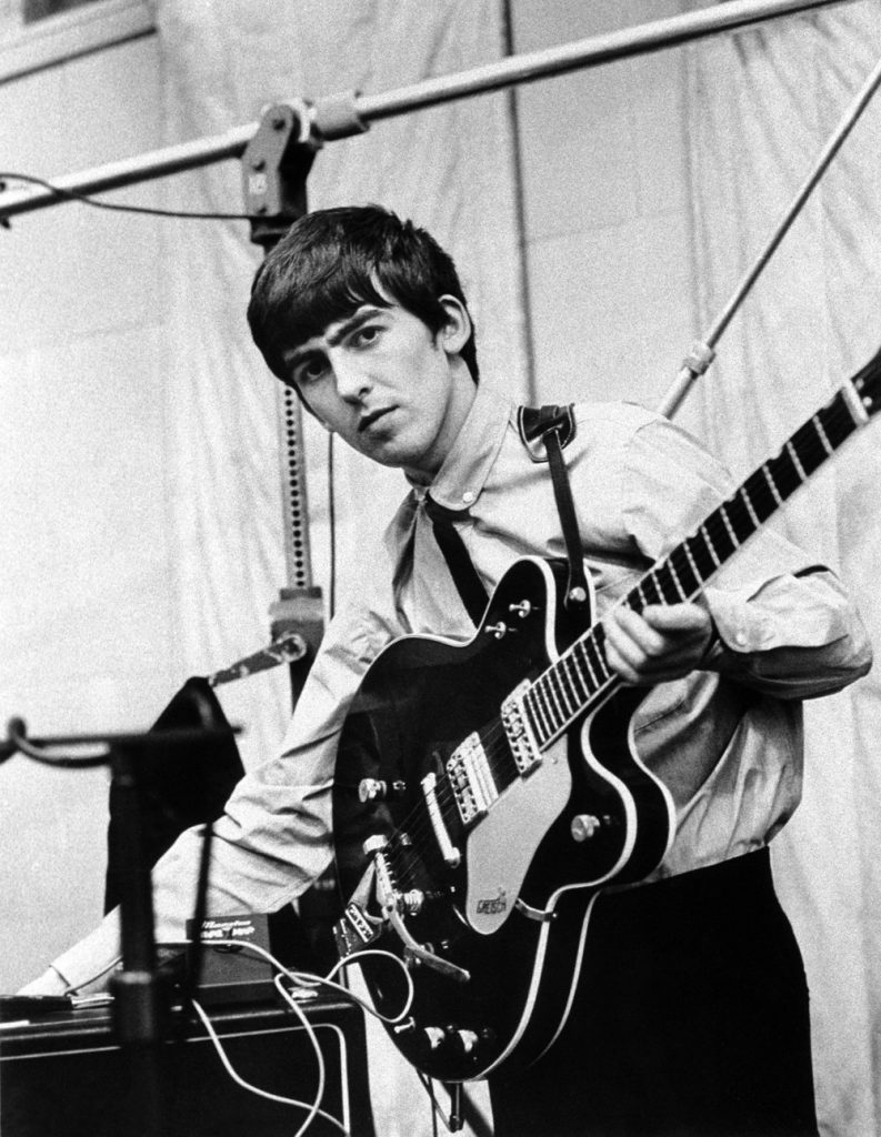 George Harrison playing guitar on July 1st 1963 with a Maestro Fuzz-Tone. (Photo credit unknown)